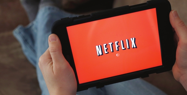 Netflix surges on user gains, strong profits