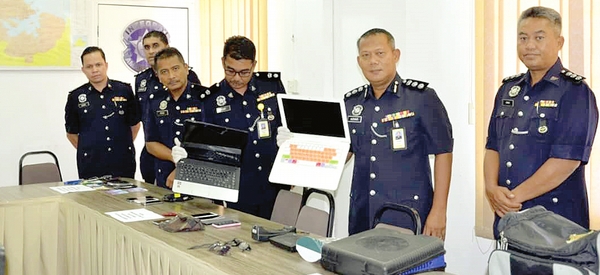 Police arrest 19  men in Sandakan,  solve 31 cases